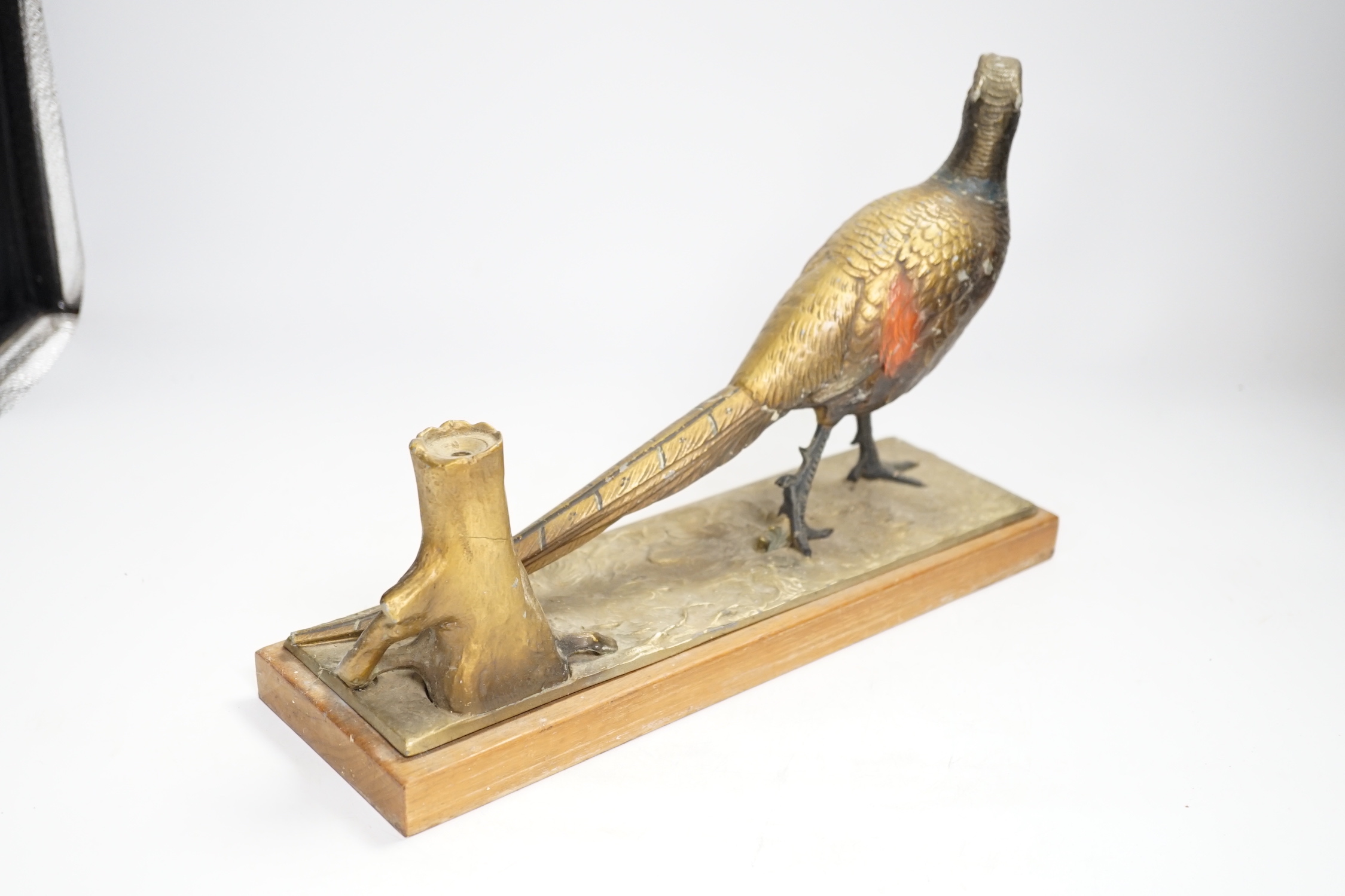 A cold painted spelter table striker, in the form of a pheasant, 31.5cm wide